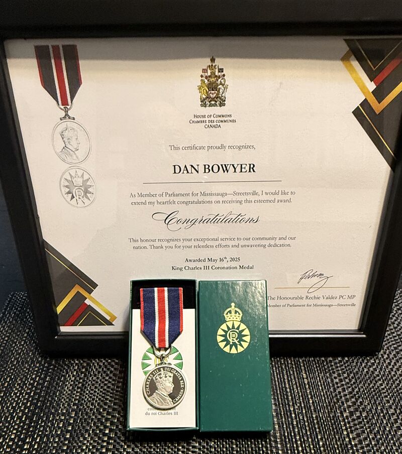 Dan Bowyer receive King Charles III Coronation Medal and Certificate from Rechie Valdez PC MP